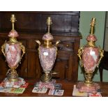 A pair of marble and ormolu mounted vase lamps and another single example (3)