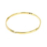 A 9 carat gold twist motif bangle, measures 6.5cm in diameter Good condition. 17.8g