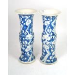 A pair of 20th century Chinese blue and white prunus vases with flared rims