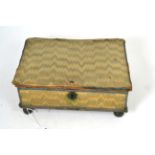 An 18th century hinged workbox, mounted in bargello flame stitch panels, edged with blue ribbon,