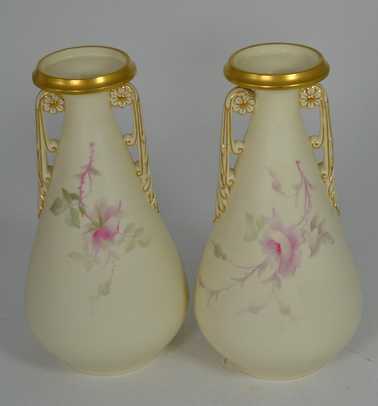 A pair of Royal Worcester China Works floral painted twin handled gilt highlighted vases, 26cm - Image 2 of 3