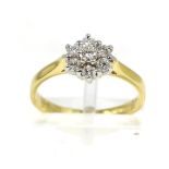 An 18 carat gold diamond cluster ring, round brilliant cut diamonds in claw settings, to knife