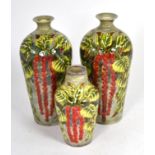 Three Cobridge stoneware vases in a foliate trail pattern date 3/11/00, the smallest 16.5cm, the