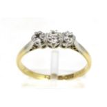 A diamond three stone ring, graduated old cut diamonds in claw settings, to knife edge shoulders,