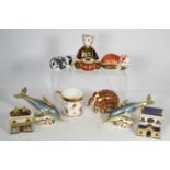 Six Royal Crown Derby paperweights comprising two blue striped dolphins, Drummer bear,