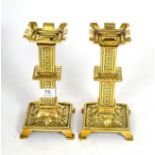 A pair of 19th century brass castellated top candlesticks