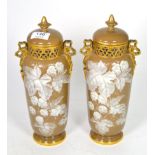 A pair of Worcester vases and covers decorated with leaves