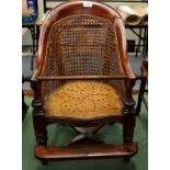 A Late 19th Century Child's Beech Framed Bergère High Chair, with curved back support and vasiform
