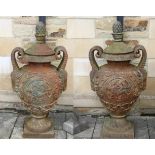 An Impressive Pair of Cast Iron Campana Shaped Garden Urns, 20th century, with removable lids and