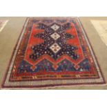 Afshar Rug South East Iran, circa 1910 The indigo field with three ivory medallions enclosed by