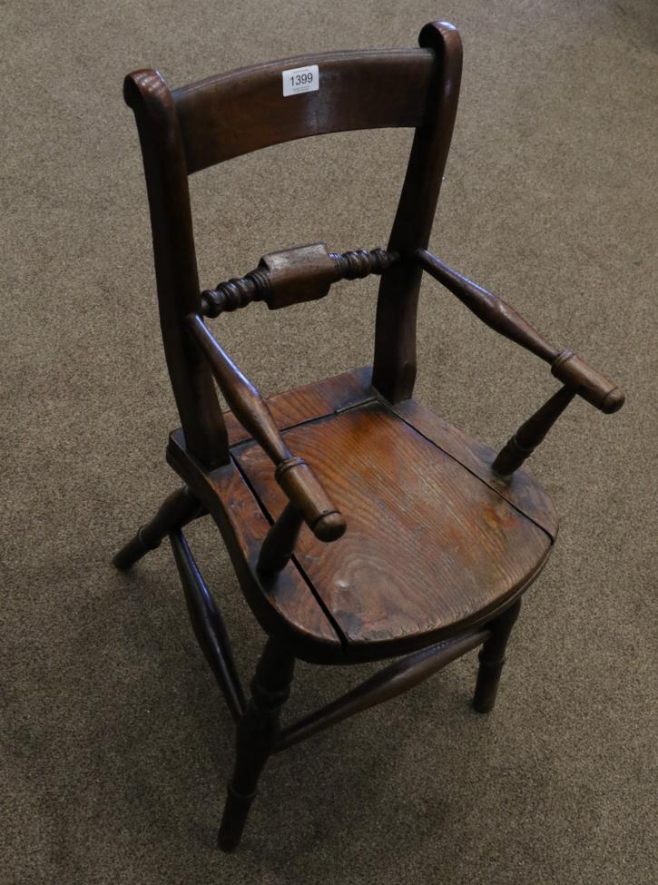 A Child's Beech and Elm Windsor Commode Armchair, late 19th century, with spindle arm supports above