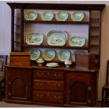 A George III Style Oak Enclosed Dresser and Rack, the rack of inverted breakfront form with dentil