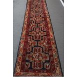 Tafrish Runner West Iran, circa 1950 The field with a column of cruciform medallions enclosed by