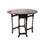 An Oak Dropleaf Table, late 17th/early 18th century, with two rounded drop leaves to form an oval,