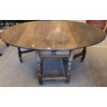 An Early 18th Century Oak Dropleaf Dining Table, with two rounded drop leaves to form an oval,