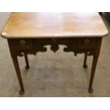 A George III Oak Lowboy or Dressing Table, late 18th century, with moulded top above three frieze