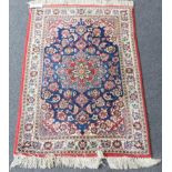 Isfahan Rug Central Iran, circa 1970 The indigo field of vines centred by a starhead medallion