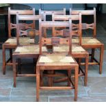 A Set of Six Oak Country and Rush-Seated Dining Chairs, 2nd quarter 19th century, with curved top
