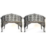 A Pair of Good Quality Cast Iron Fern and Berry Garden Benches, 20th century, of curved form with