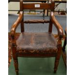 An Early Victorian Child's Armchair, upholstered in close-nailed brown leather, with ring turned