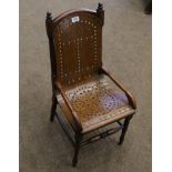 A Child's Stained Beech Armchair, circa 1900, with a brass studded pierced solid seat and turned