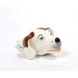 An English Porcelain Whistle, circa 1830, in the form of a dog's head with brown markings, 5cm long