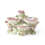 A Bow Porcelain Shell Centrepiece, circa 1765, as six shells painted with chinoiserie flowers on a