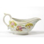 A Derby Porcelain Sauce Boat, circa 1760, painted with flowersprays within moulded and painted