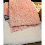 A pink paisley cotton reversible quilt, a white cotton quilt and a bed cover (3)