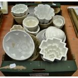 A pottery jelly mould, 19th century, moulded with fruit; and nineteen various 19th and 20th
