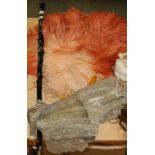 Circa 1920s large peach ostrich feather fan with yellow resin sticks and guards, a woven metallic