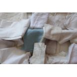 A Quantity of Assorted White Linen and Cotton Textiles, including table linen, tray mats, bed