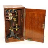 Baker (High Holborn) Microscope with course/fine focusing, circular stage with varying size