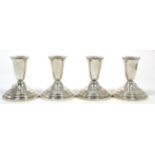 ~ Set of four sterling silver dwarf candlesticks, 9.5cm high