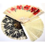 Large mother of pearl fan painted with floral motifs in silver and gold, fabric mount hand decorated