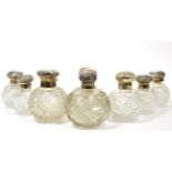 ~ Eight assorted silver lidded scent bottles