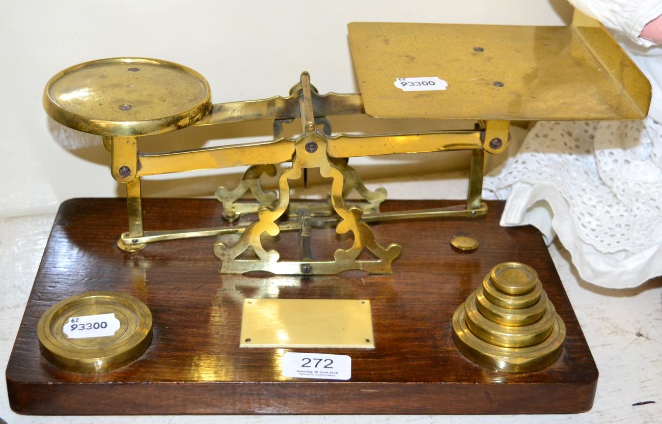 ~ A set of brass desk scales and weights on an oak plinth