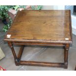 A Oak Coffee Table, modern, of rectangular moulded form, raised on gun barrel turned legs joined