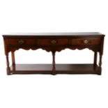 A Titchmarsh & Goodwin Oak Dresser Base, RL 36/4, 188cm by 46cm by 76cm