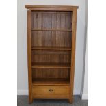 An Oak Free-Standing Bookcase, modern, with three fixed shelves above a long drawer, 90cm by 38cm by