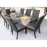 A Glass Top Dining Table, modern, of canted rectangular form with bevelled edge, raised on a pair of