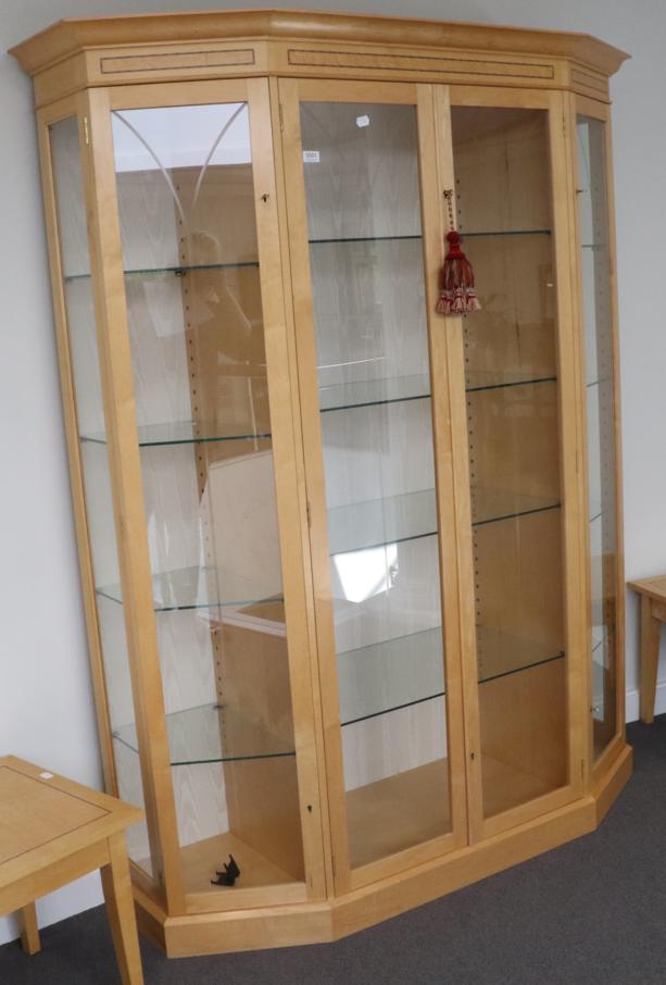 A Beech Display Cabinet, modern, of canted form with etched glazed doors enclosing five adjustable