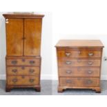 A Walnut and Feather-Banded Audio Cabinet, modern, in the form of a linen chest with double doors