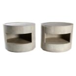 A Pair of Leather Shagreen-Effect Oval Bedside Tables, each with two bowfront drawers and raised