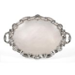 A Large Late Victorian Twin-Handled Silver Tray, Martin & Hall, Sheffield 1900, shaped oval with C