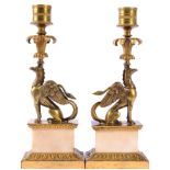 A Pair of Gilt Metal and Marble Candlesticks, early 19th century, with drum sockets above leaf