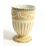 A Wedgwood Creamware Urn Shaped Vase, late 18th century, moulded with drapery swags within engine