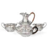 An Edwardian Silver Four Piece Tea Service, Reid, Langford & Reid, London 1906/07, retailed by