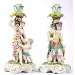 A Pair of Derby Porcelain Figural Candlesticks, circa 1765, modelled as Mars, and Venus and Cupid,