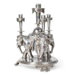 An Electroplated Table Centrepiece, apparently unmarked, late 19th century, modelled as three
